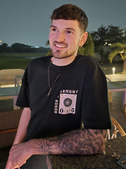 Model wearing Honour and Harmony hunter green oversized men’s t-shirt round neck half sleeves, organic cotton 210 GSM. Relaxed and casual fashion